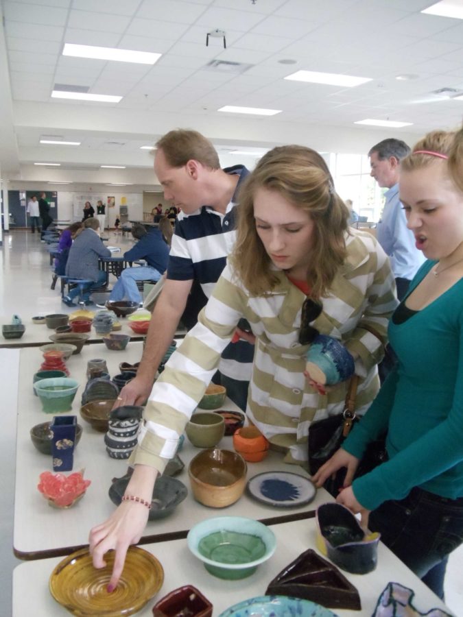 Patrons of the event peruse the hand-crafted bowls.  Photo/ Taylor Werdel