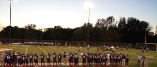 The varsity squad looks on as the offense goes for 3rd and 5

Photo/ Woody Hust