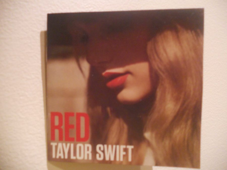 What’s heartbroken, relatable and red all over? Taylor Swift’s new album. 

Relationships with Joe Jonas, Taylor Lautner, Jake Gyllenhaal, John Mayer, and most recently Conor Kennedy have influenced her album. Taylor Swift is known for writing songs about ex-boyfriends. The twenty-two year old country singer has four albums under her cowgirl boots, but does her newest album, Red, live up to its expectations? Or, did Swift finally reach the end of her heartbreak writing days?
The first single released off of Red was “We Are Never Ever Getting Back Together.” The song, being the perfect post-breakup anthem, skyrocketed to the top of the charts when it was released. 

Swift set the tone for her new album by releasing this track which incorporates a harmony of easy going guitar rifts and a sweet, pop beat. This slight change in style is present throughout the album as Swift continues to grow as an artist. Rumor has it that this song is inspired by actor Jake Gyllenhaal. Whether it is actually based off of him or not, “We Are Never Ever Getting Back Together” is relatable to anyone going through a break up. 

“I Knew You Were Trouble” describes the guy who is bad from the start. Swift wrote the lyrics, “I knew you were trouble when you walked in / So shame on me now / Flew me to places I’d never been / Now I’m lying on the cold hard ground,” to make up the strong chorus of the song. Bass and techno beats are embedded into “I Knew You Were Trouble”, setting the tone for that bad boy on any girl’s mind. 

The title song, “Red” is all about a guy that whirled a girl around an emotional roller coaster. “Loving him is like driving a new Maserati down a dead-end street / Faster than the wind, passionate as sin, ended so suddenly.  This line stands out, emphasizing a love that burns quickly before halting at a screeching stop; a love so innocent and powerful that just disappears. 

The verses, paired with a catchy tune, make for one of the strongest songs on the album. This song is definitely relatable to teen girls because it perfectly describes the guy who is difficult to get over.

Swift knows how to write a good love song, but she also know how to change it up. The song entitled, “22”, on her new album follows “Fifteen” from her second album, Fearless. “22” is a going out anthem about living life to the fullest, even though teens are young and will make mistakes. It’s about forgetting what happened during the day and just letting it all out. 

At the age of twenty-two, Swift describes exactly what her outlook on life is right now. “We’re happy free confused and lonely at the same time / It’s miserable and magical.” Songs like this balance out all of the breakup songs on her album.

Red is the continuation of Swift maturing as an artist. She begins to turly define herself in this album. Swift is headlining her own tour in 2013 and takes the stage in Minneapolis on Sept. 7 and 8. 

Even if the guys she writes about remain a mystery, one is solved: Red is the album to listen to. 

