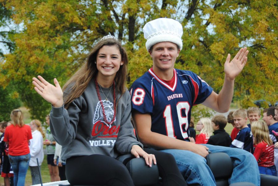 Photo/ Jack Ellis
Senior Queen and King (right to left), Paige Broghammer and Ben Turnham, wave to the crowd from their convertible.  

