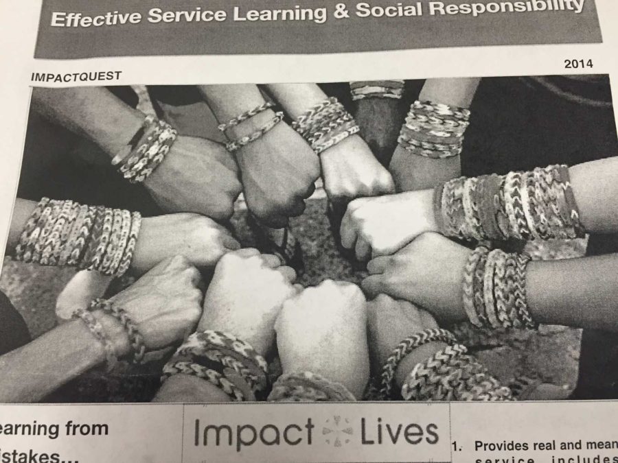 Students were handed flyers during the presentation, promoting Impact Lives work.