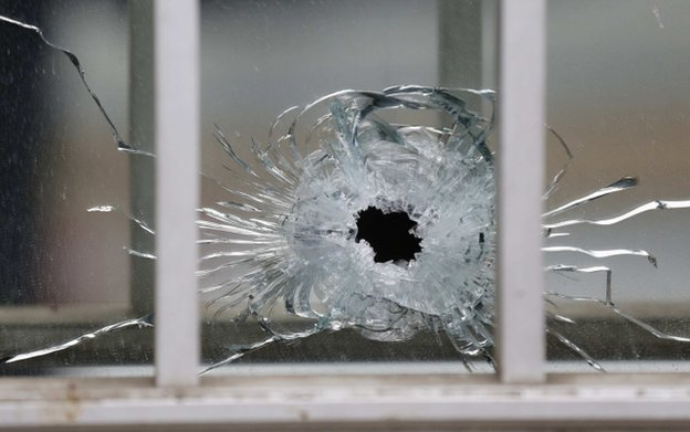 Glass shattered by bullet at Charlie Hebdo office