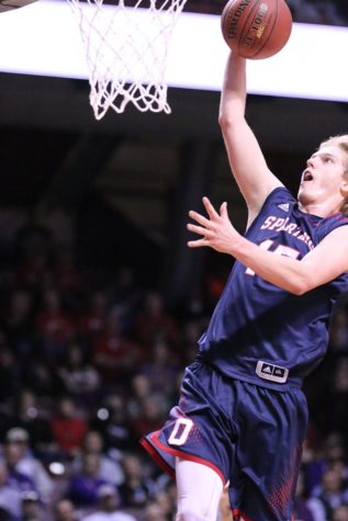 Sustacek throwing down a dunk during the state game against Waconia
