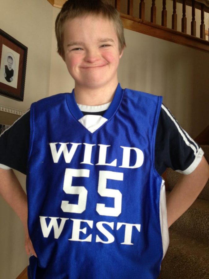 Pierce Pennaz poses with his teams jersey, the Wild West.