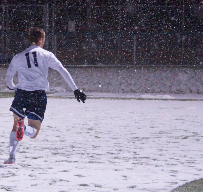 The+boys+soccer+team+fought+the+snow+during+the+game.