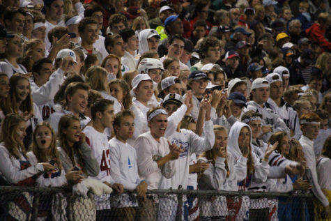 The OHS fan section keep their focus on the field.