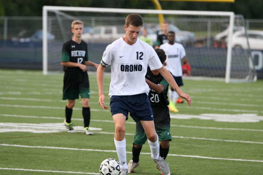 Connor Hasselman dribbles the ball down the field. 
