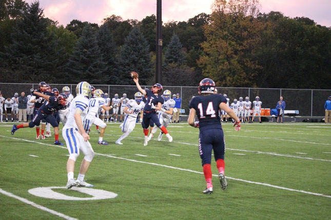 Quarterback Nick Prentice throws the ball down the field during Homecoming. 