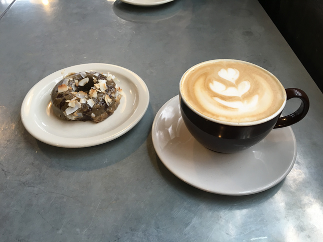 A vanilla latte and Sift donut from Vicinity Coffee
