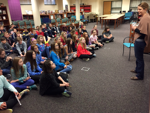 Orono alum Abby Fabiaschi talks with OMS sixth graders.