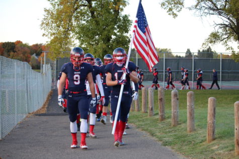 The football team marches to the field on Oct. 13.