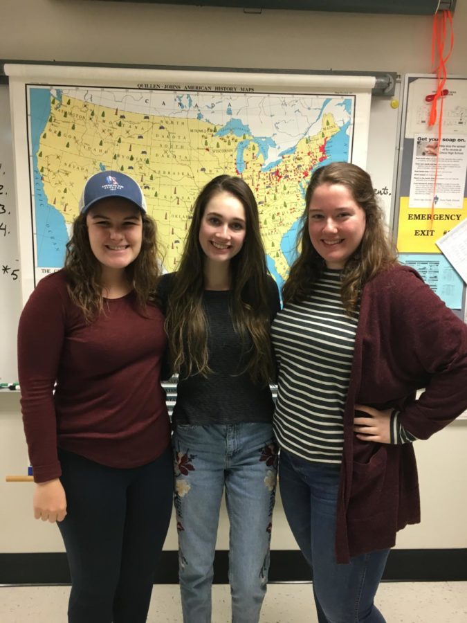 Seniors Mollie McGrann, Kelly Rash and Caroline Koehl get together to plan their future meetings on the Current Events club.