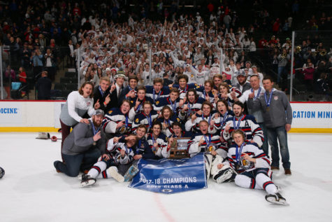 The OHS boy's hockey team poses with their fans after winning the championship.