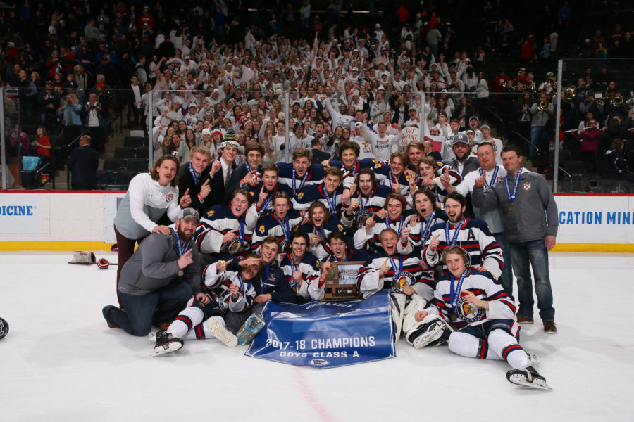 The+OHS+boys+hockey+team+poses+with+their+fans+after+winning+the+championship.