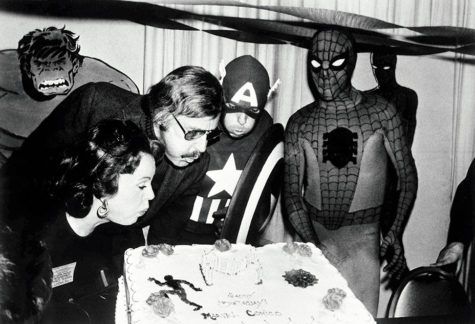Marvel comic book publisher, Stan Lee (center left), blows out the candles on the Marvel Comics birthday cake at opening day ceremonies of the First Mighty Marvel Comic Book Convention, Mar. 22, 1975, New York. To the left is Lee’s wife Joan and on the far right, Spider-Man. Another Marvel superhero, Captain America helps blow out the candles.