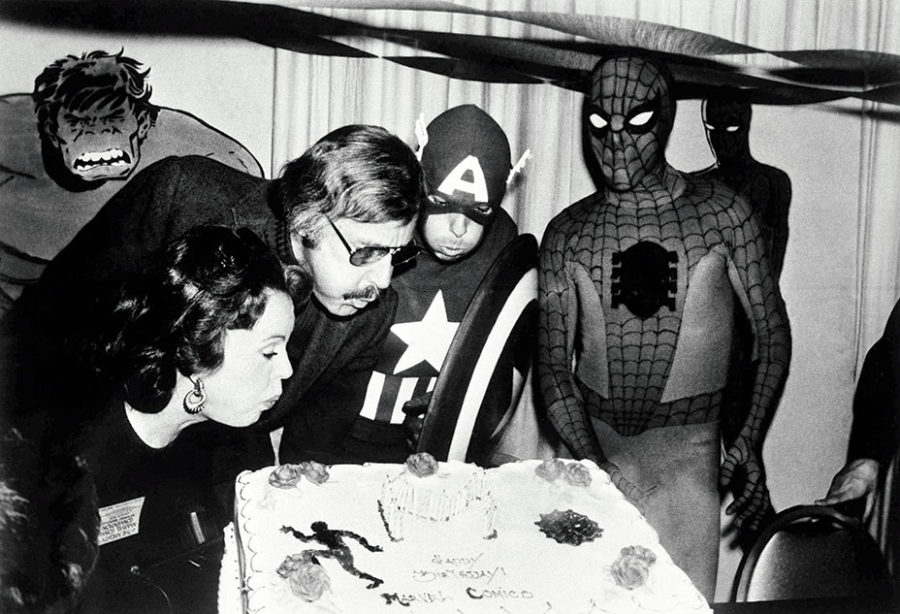 Marvel+comic+book+publisher%2C+Stan+Lee+%28center+left%29%2C+blows+out+the+candles+on+the+Marvel+Comics+birthday+cake+at+opening+day+ceremonies+of+the+First+Mighty+Marvel+Comic+Book+Convention%2C+Mar.+22%2C+1975%2C+New+York.+To+the+left+is+Lee%E2%80%99s+wife+Joan+and+on+the+far+right%2C+Spider-Man.+Another+Marvel+superhero%2C+Captain+America+helps+blow+out+the+candles.