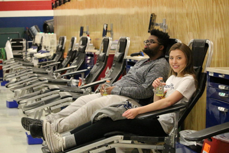 Seniors Jaylynn Buesgens and Kendall Kirk preparing to donate blood.