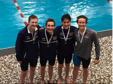 Peter Kasner, Jack Marquis, Cameron Davison, and Henry Luetmer posing for a photo right after they made it to state. 