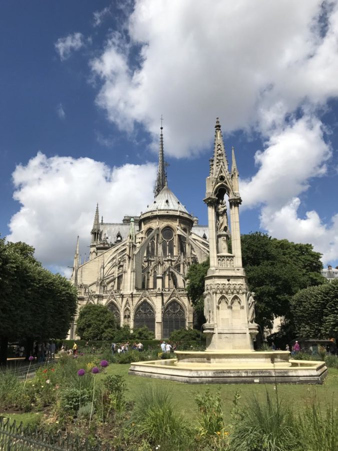 The Cathedral of Notre-Dame standing tall on a perfect day in Paris.
