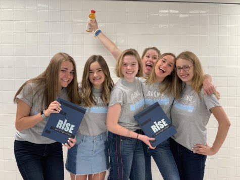 Yearbook adviser Sarah Cole and yerds Katherine Gilster, Lauren Proulx, Carolyn Fritz, Ellen Kittredge and Hannah Thillman show off their final product