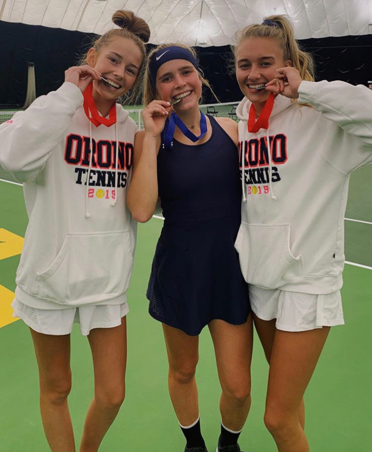 Lily Anderson with fellow teammates Carli Olsen and Taylor Gill smiling with their medals for placing in sections and making it to state.