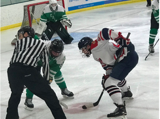 Tensions rise high as the puck is dropped in a face-off vs Edina on Dec. 18.