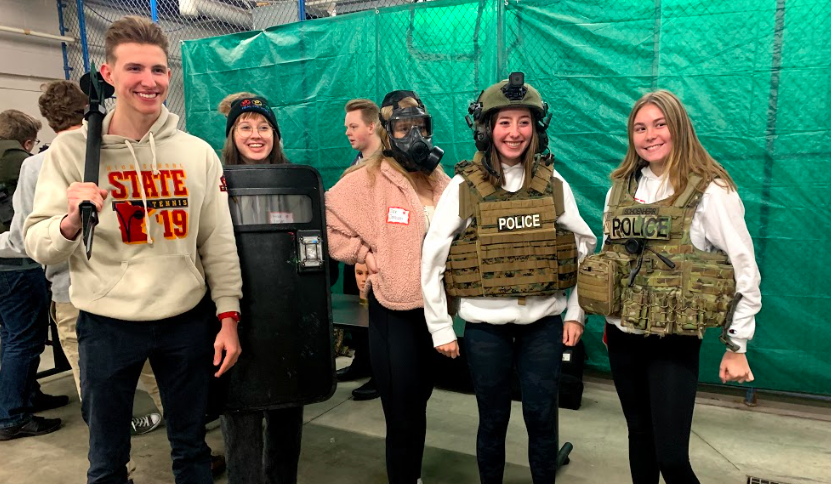 Seniors Ethan Blum, Grace Larsen, Jane Jonassen, Amelia Singleton and Audrey Link are decked out in gear on the forensics field trip. 