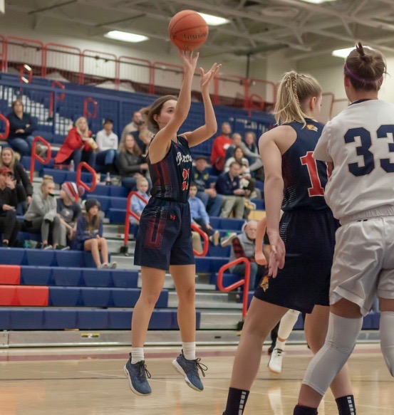 Senior and basketball captain Amelia Singleton going up for a shot.