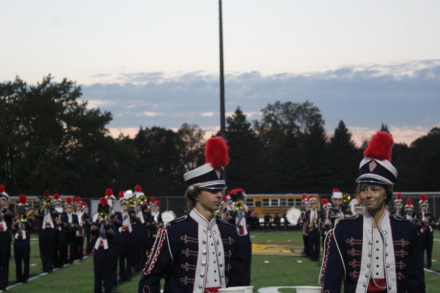 Preparing to conduct the high school band during the halftime of the Homecoming football game, seniors David Antonenko and Carli Olsen put on a concentrated face full of determination.