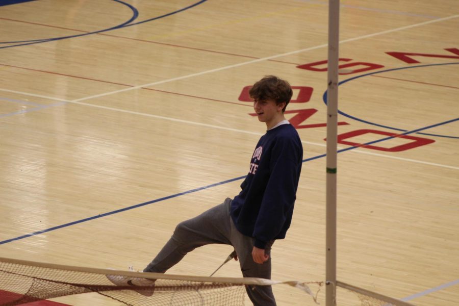 A student joyfully jokes around while playing badminton during 5th hour gym class with Mr. Wohler. 