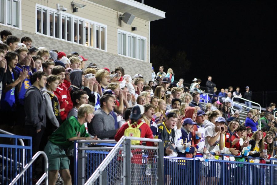 During the boys state semi-final soccer game at Pesonen Stadium, the student section cheers on the boys after another goal. 