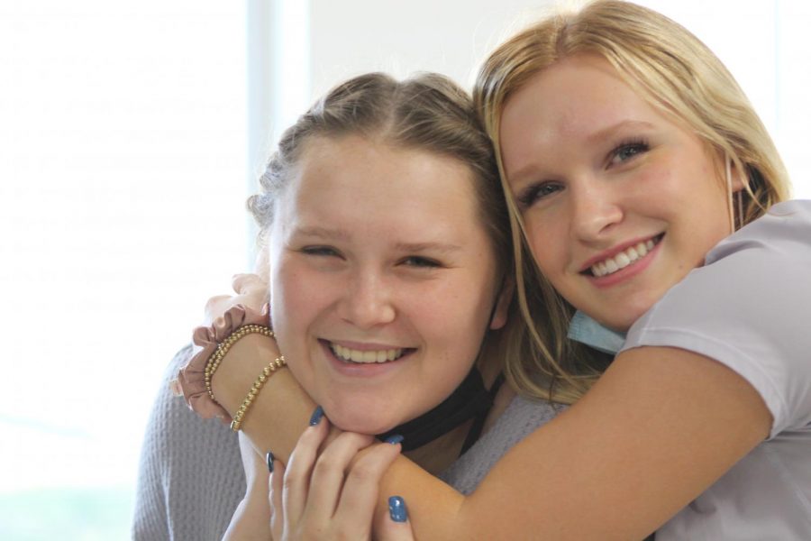 Seniors Libby Engebretson and Sydney Heckmann embrace their friendship which has grown over the past couple of months in Mrs. Herring’s Journalism II class.