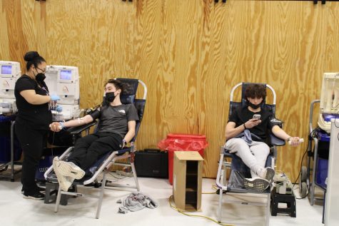 Students donate blood to the local blood drive.