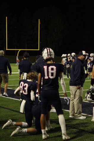 Image of players on the sidelines of an Orono Football game.
