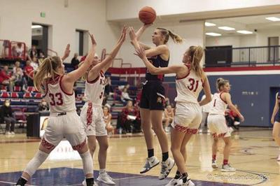 Kaila Youngs, former captain of the Orono girl's basketball team, shoots in a game against Benilde.