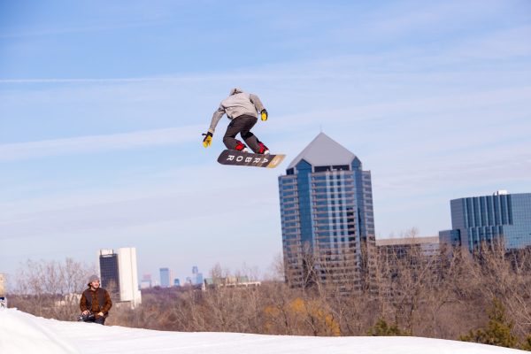 A snowboarder soars above the terrain park at Hyland Hills Ski/Snowboard Area