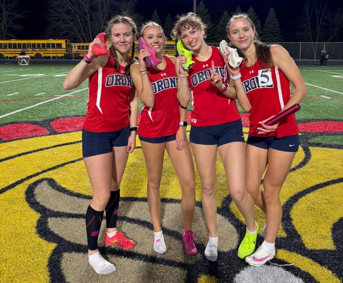 (From left to right) Sindri Bonner, Taylor Walsh, Alivia Uselding, and Ryanne Andreen pose after winning their 4x800 race.