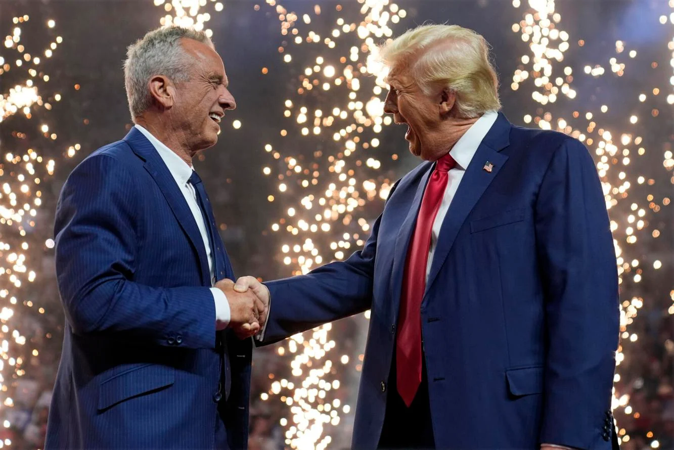 Mr. Kennedy shakes hands with Mr. Trump at a rally for the former president after dropping out of the presidential race and endorsing him.