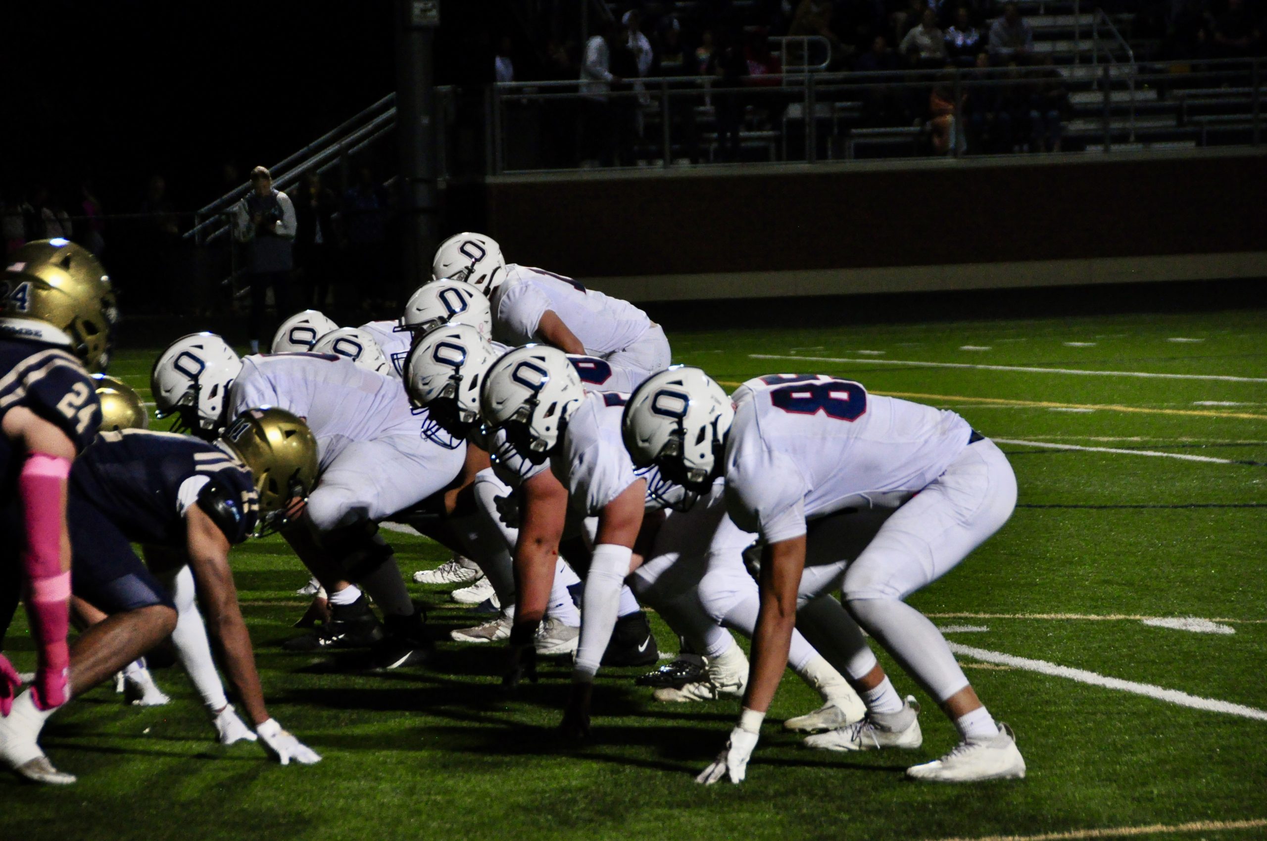 Orono football lines up against Providence Academy.