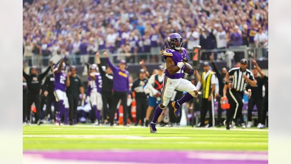 Vikings running back Aaron Jones running into the end zone for a touchdown.