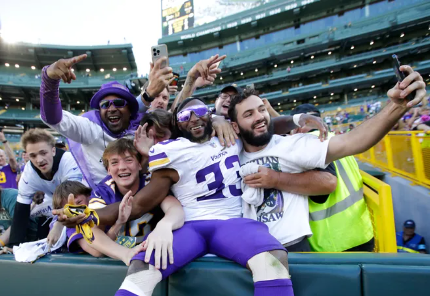 Vikings Running Back and former Packers Running Aaron Jones was seen doing the Lambeau Leap, a Packers tradition.