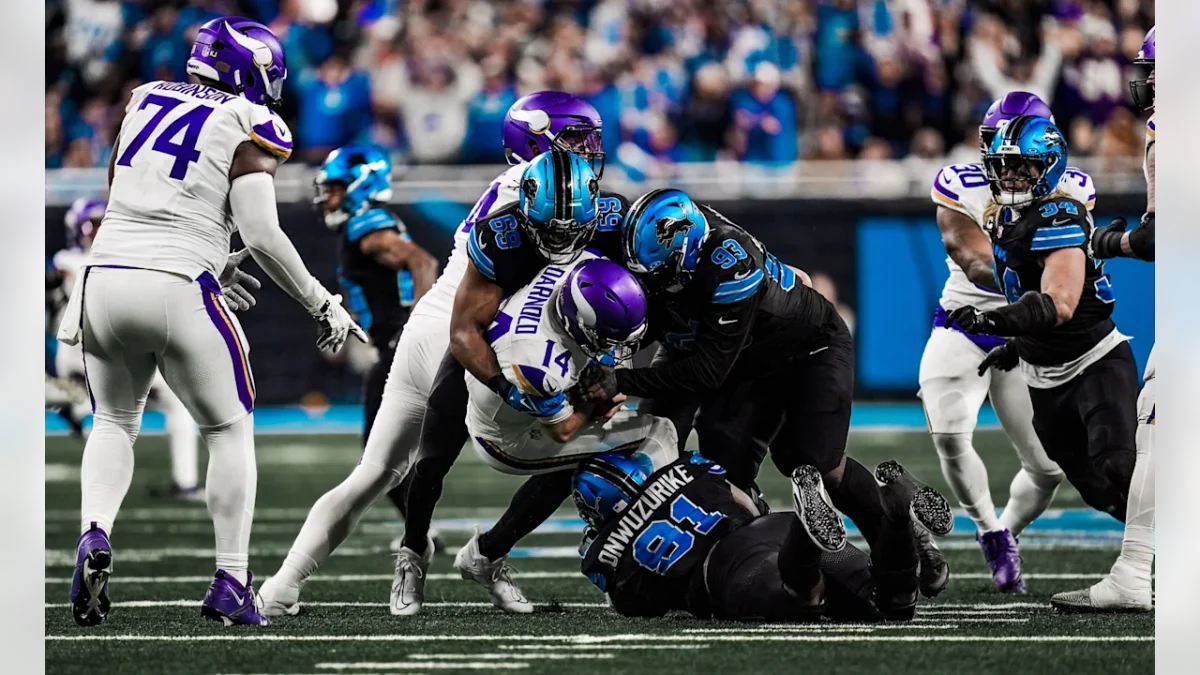 Detroit defensive lineman Al-Quadin Muhammad (69) sacks Vikings quarterback Sam Darnold (14).