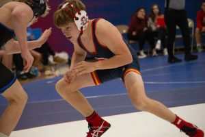 Bennett Williams (WC: 114LBS) lunges for his opponent.