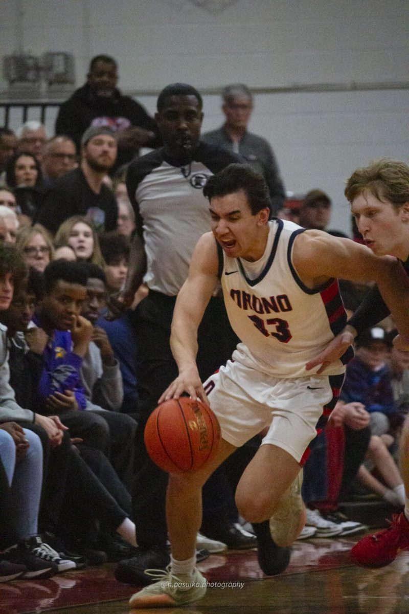 Mitchell Kauch rushes to rushes to the basket.