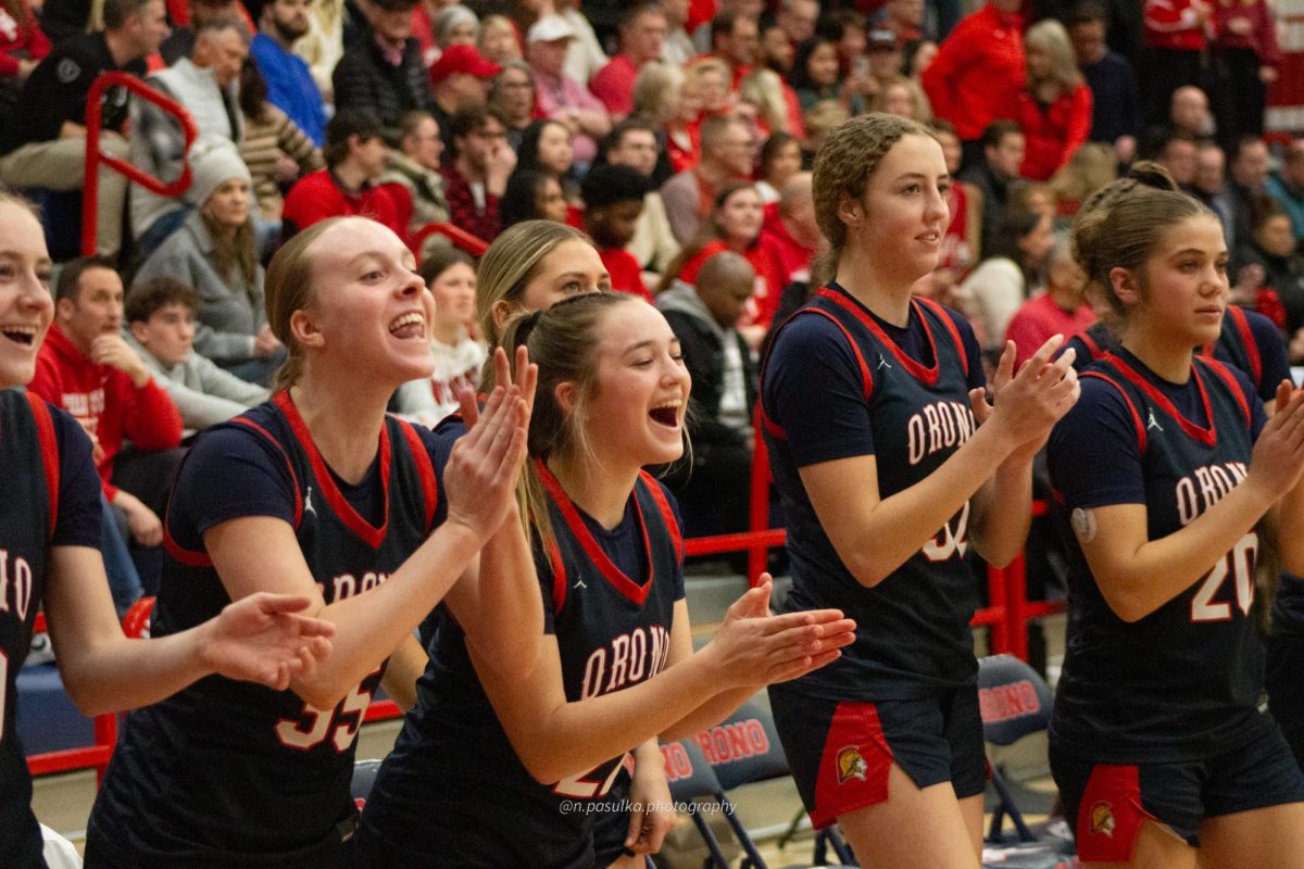 The girls cheer on their teammates.