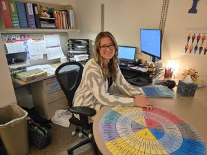 OHS's newest counselor, Ms. Condry, smiles in her office.