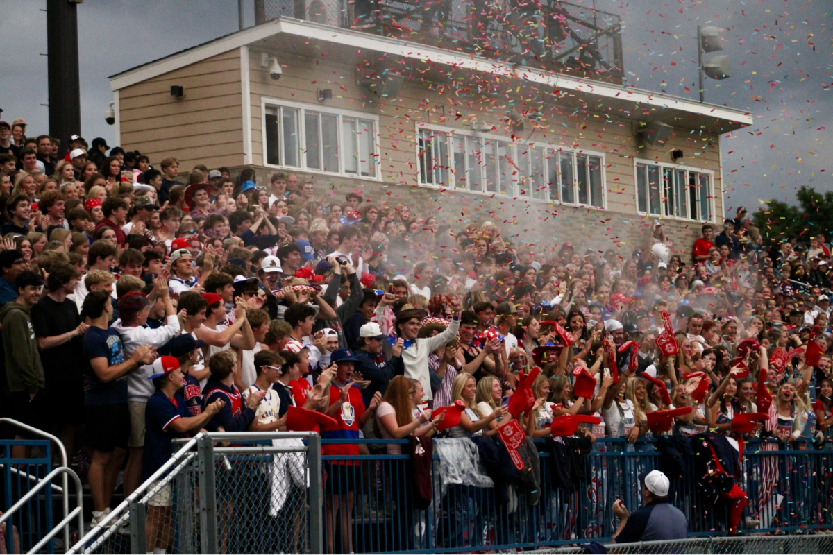 The Orono student section celebrates after a touchdown.