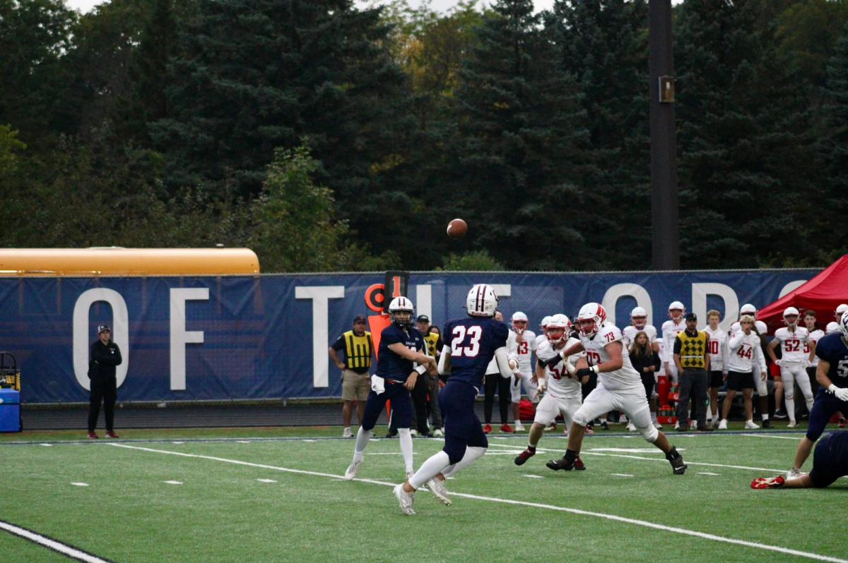 #13 Griffin Mauer passes the ball to #23 Rory Kvern.