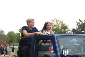 Homecoming King Dane Kanwischer and Queen Ariah Ragan ride in the parade.