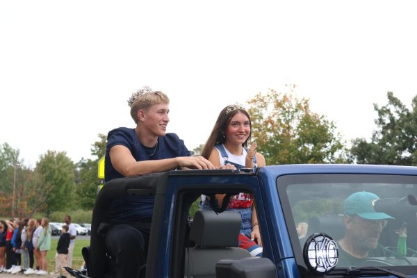 Homecoming King Dane Kanwischer and Queen Ariah Ragan ride in the parade.